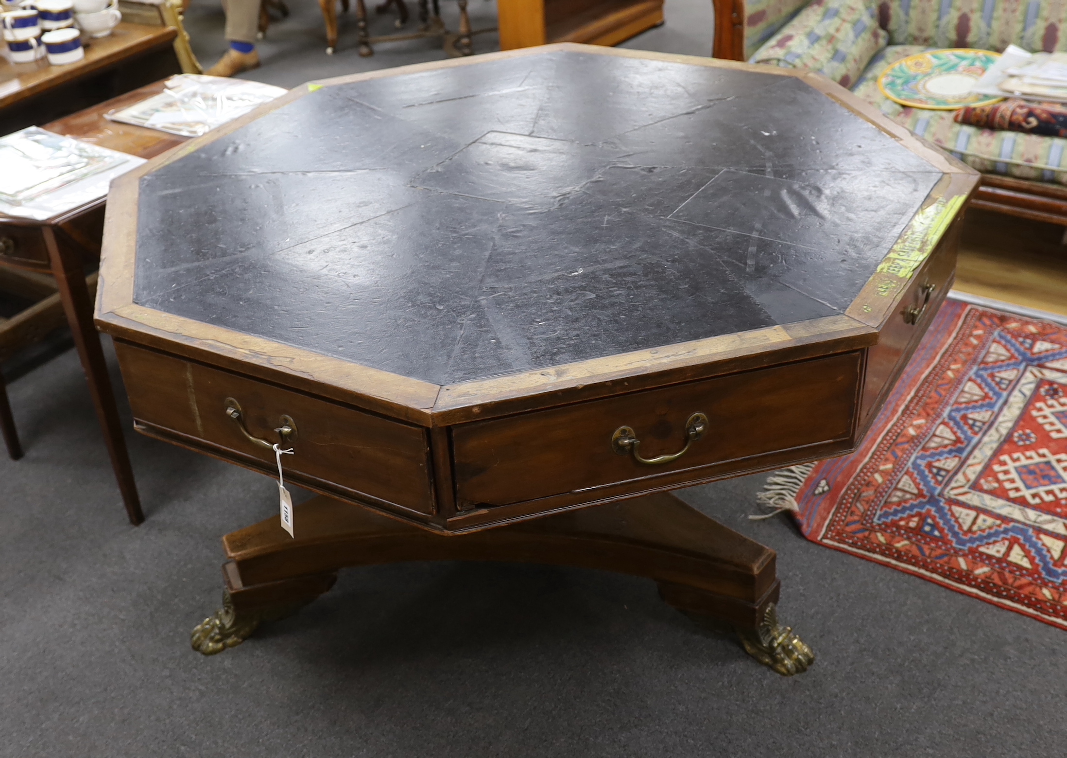 A George IV octagonal mahogany drum library table, width 130cm, height 77cm